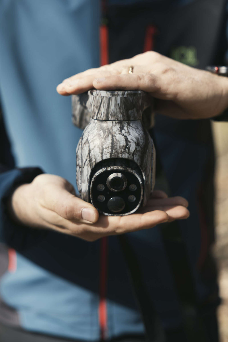 Campark TC17 4G trail camera with solid durable build shown handheld for rugged outdoor use.